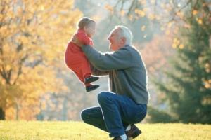 grandfather lifting child in autumn landscape1.JPG