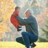 grandfather lifting child in autumn landscape1.JPG